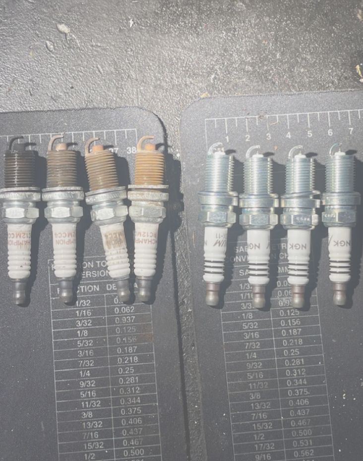 Old vs new spark plugs replaced by Tipton's Mobile Mechanic